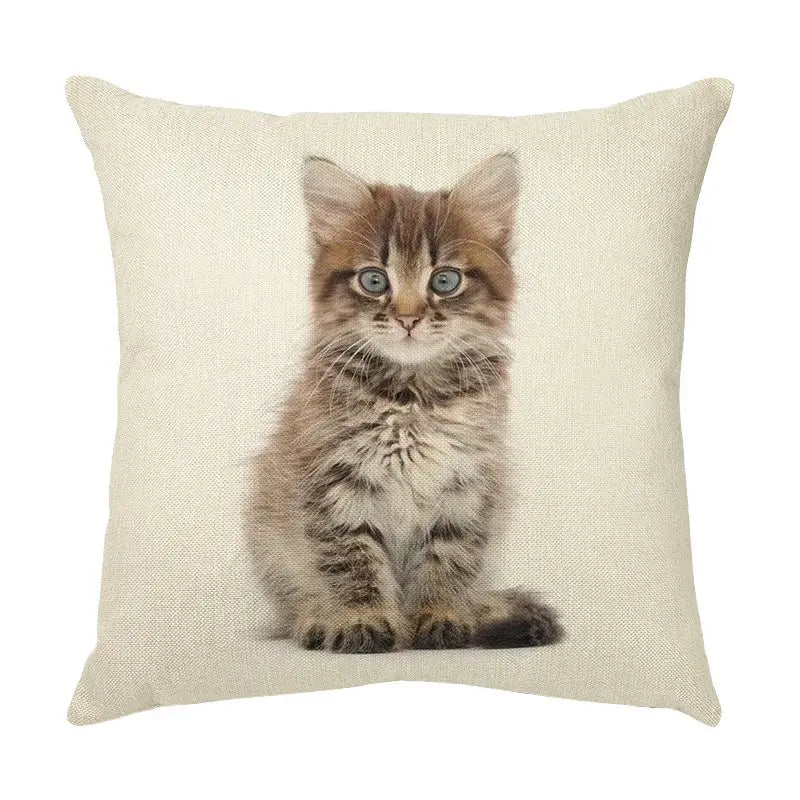 Beige linen throw pillow with cute cat face featuring a fluffy tabby kitten and striking blue eyes decorative cushion