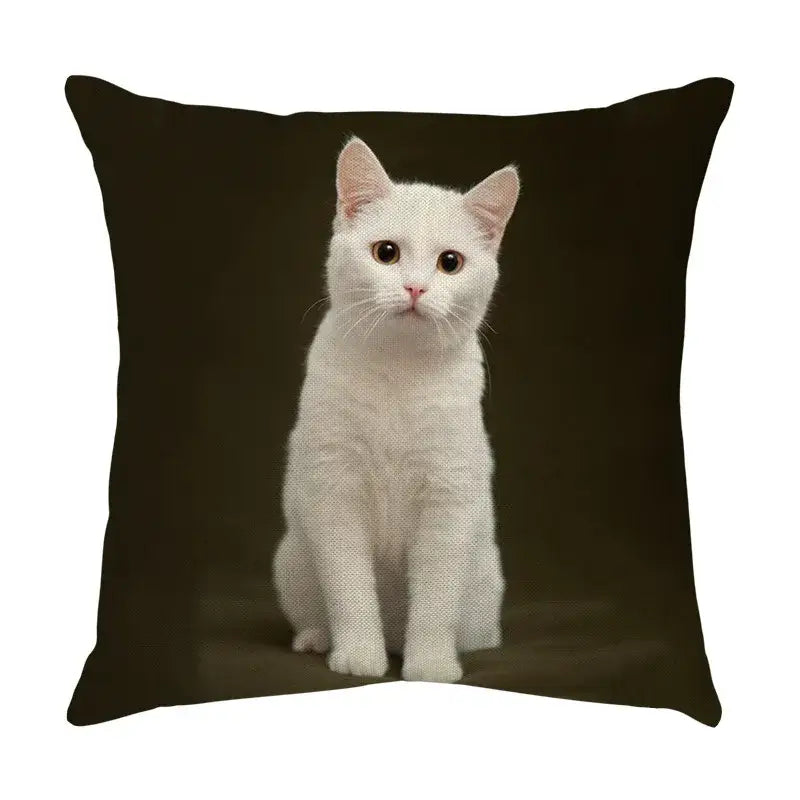 Black throw pillow with a cute cat face decorative printed image of a white cat for living room use