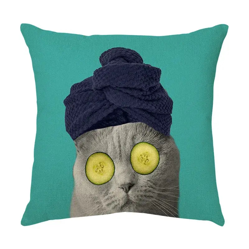 Teal throw pillow featuring a cute cat face decorative gray cat with cucumber slices and navy blue towel turban