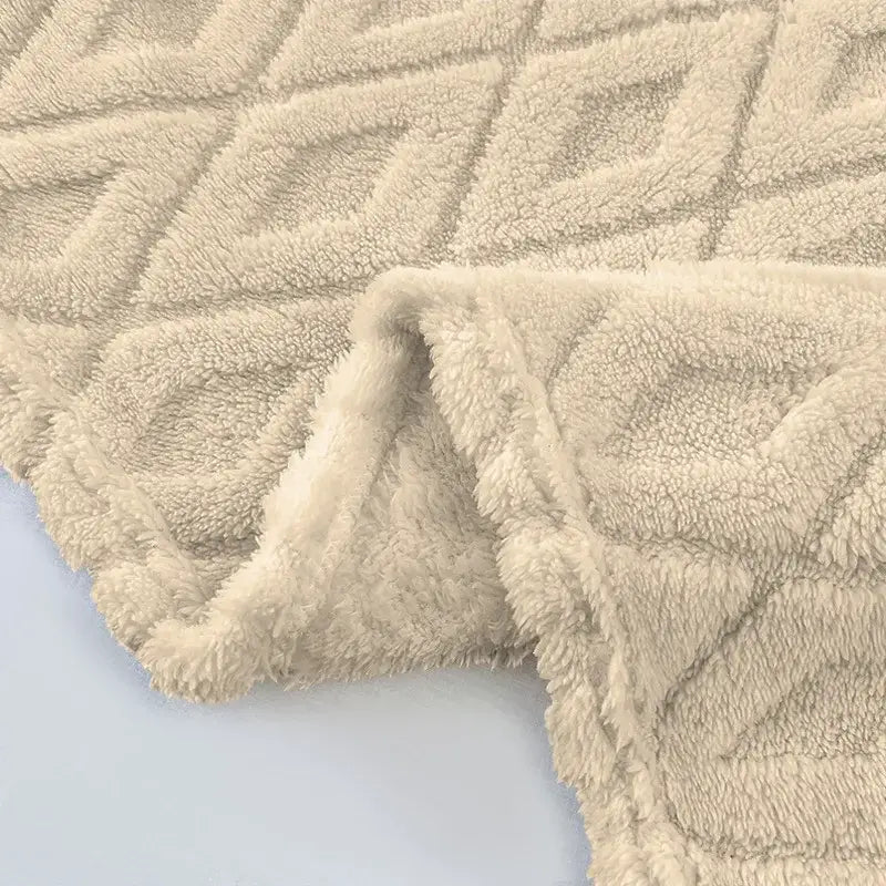 Cream diamond jacquard coral fleece blanket with plush fuzzy texture and diamond-quilted pattern for bedroom throw