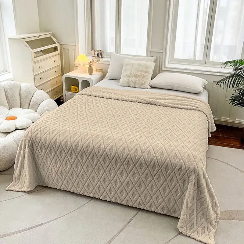 Cream diamond jacquard coral fleece throw blanket with beige quilted plush texture and diamond-patterned stitching
