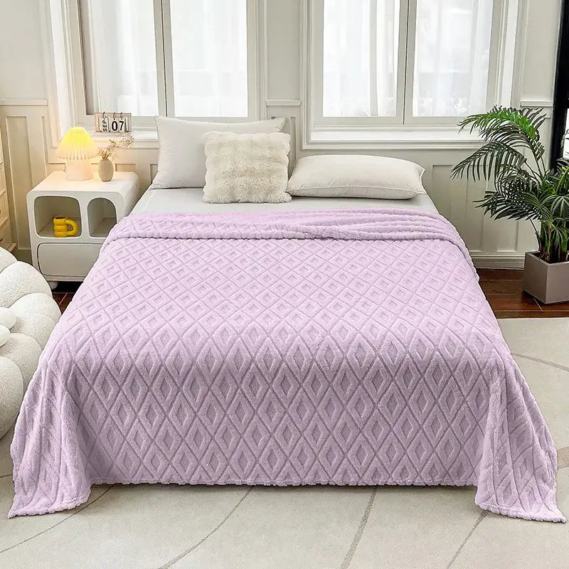 A soft lavender diamond jacquard coral fleece throw blanket with plush texture for bedroom bedding use