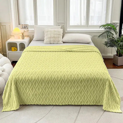 A soft light green quilted throw blanket with diamond jacquard coral fleece texture for bedroom bedding