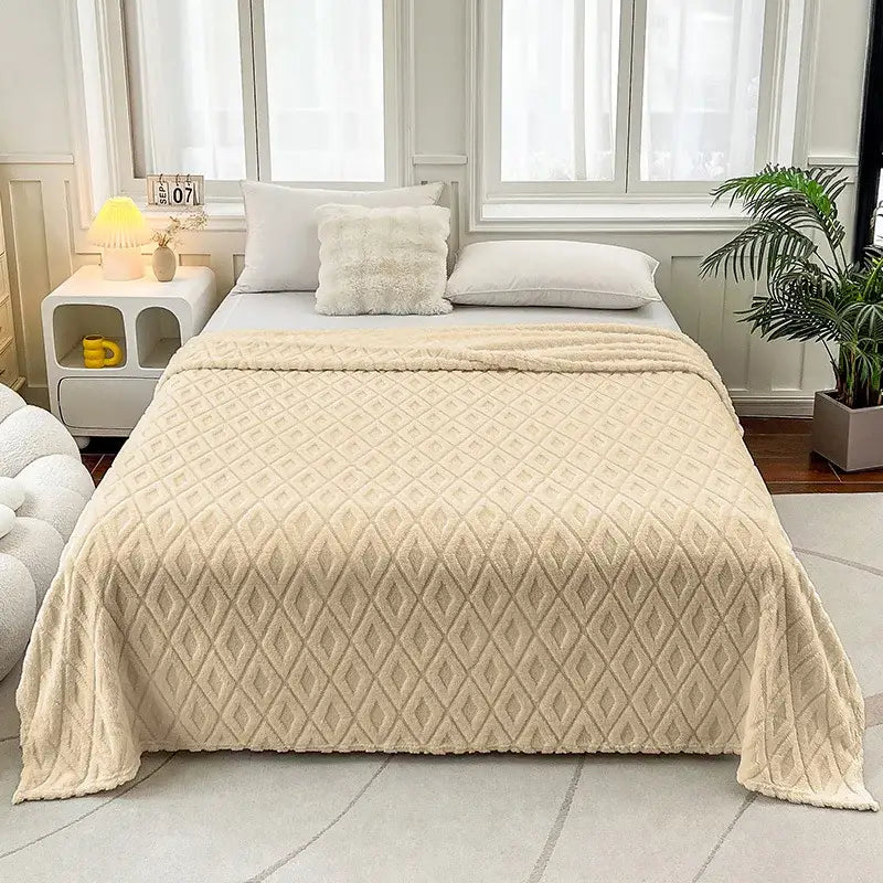 Cream-colored diamond jacquard coral fleece throw blanket with quilted design for bedroom bedding use