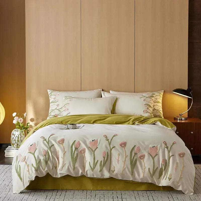 Cream egyptian cotton bedding set with tulip embroidery in pink and green paired with olive-green velvet bed skirt