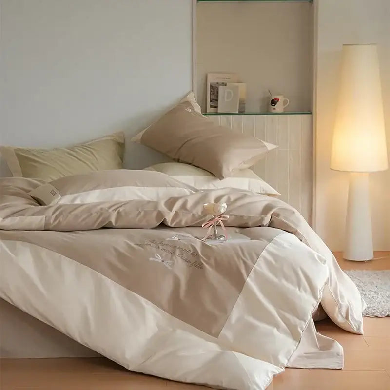 Cream embroidered brushed volcanic fleece bedding set in beige and white with delicate butterfly quilted design