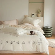 Cream embroidered brushed volcanic fleece bedding set in cream with black tree and house illustrations for bedroom decor