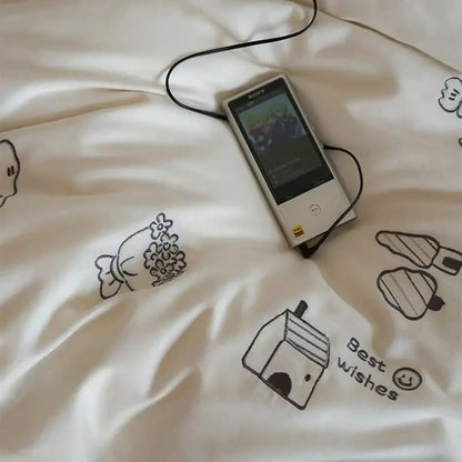 Silver sony walkman with black earphones resting on cream embroidered decorbites brushed volcanic fleece bedding set
