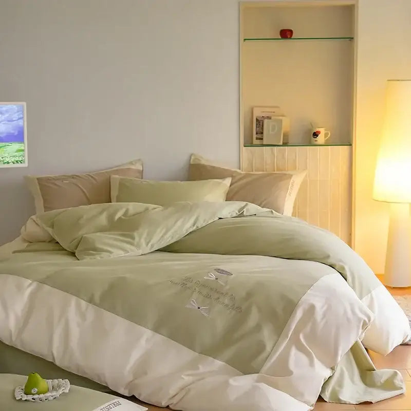 Soft sage green and white bedding set with delicate embroidery made of decorbites brushed volcanic fleece material