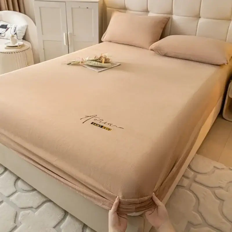 Beige cozy velvet fitted sheet with aqua fantasy logo embroidery and yellow banner for bedroom decorbites cozy velvet use