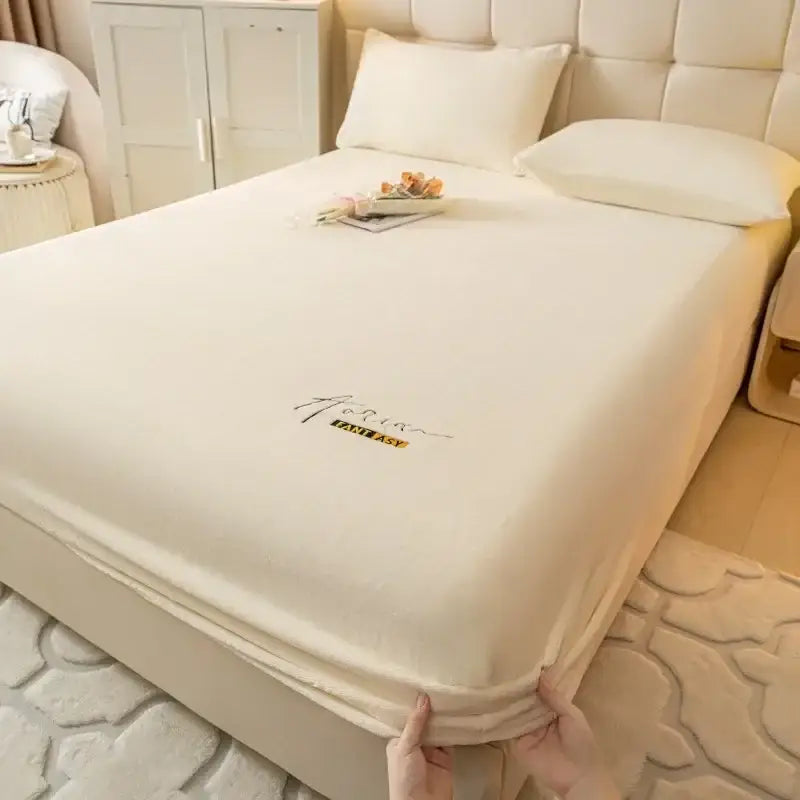 Cream embroidered cozy velvet fitted sheet in cream with soft texture and yellow fantasy logo for bedroom decorbites cozy velvet fitted use