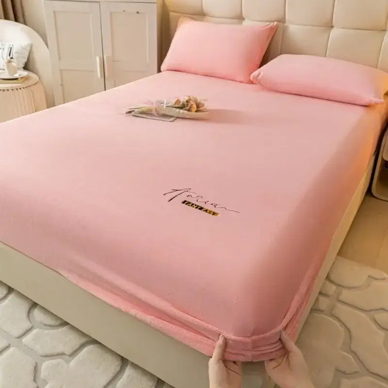 Pink satin-like cozy velvet fitted sheet with gold embroidered fantasy text for decorbites cozy velvet bed cover