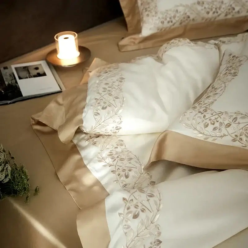 Cream embroidered egyptian cotton bedding set with delicate gold-threaded floral embroidery on cream satin duvet cover