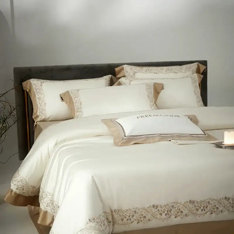 Cream embroidered egyptian cotton bedding set with satin duvet cover and beige floral embroidery on matching pillowcases