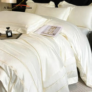 Cream embroidered ice silk bedding set in cream color with elegant leaf embroidery on satin duvet edges