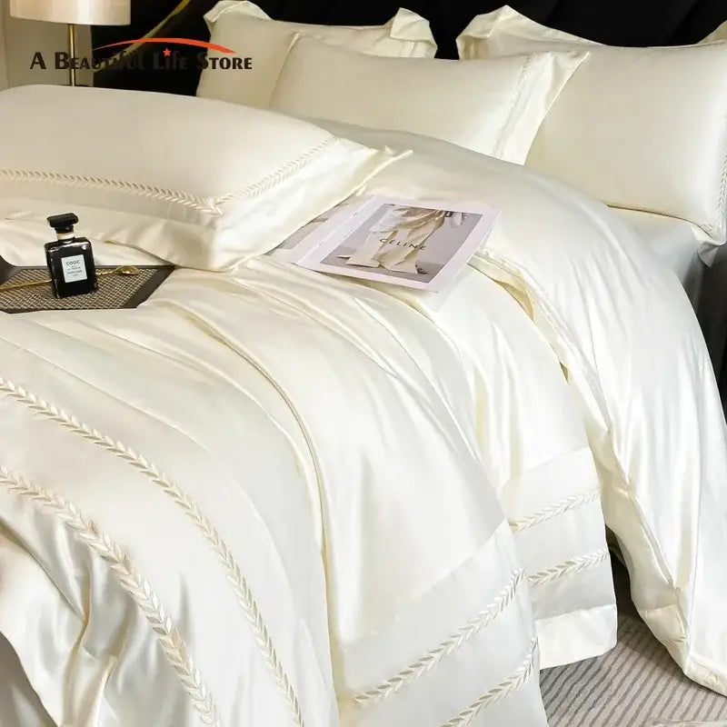 Cream embroidered ice silk bedding set in cream color with elegant leaf embroidery on satin duvet edges