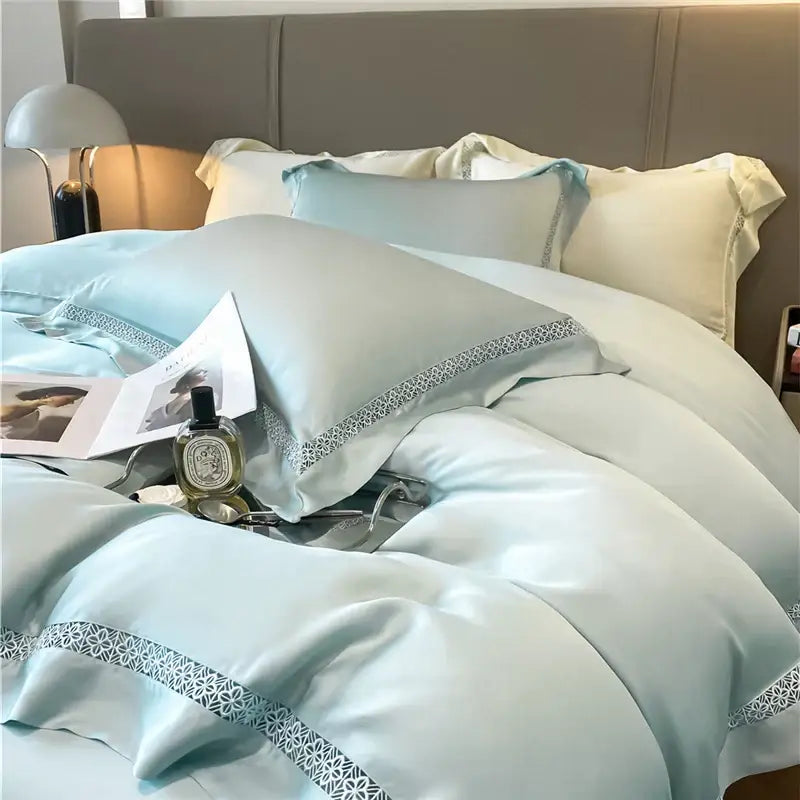 Light blue satin bedding set with silver geometric embroidery made from cream eucalyptus fiber by decorbites eucalyptus fiber
