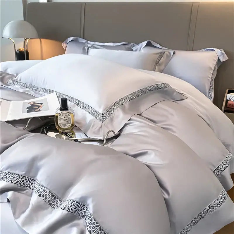 Luxurious silver satin bedding set with elegant geometric embroidery made from eucalyptus fiber for bedroom comfort