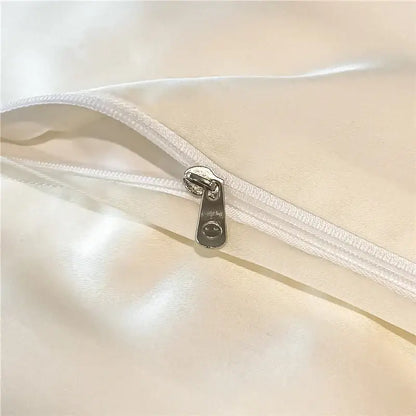 Silver zipper pull with smiling face on white satin eucalyptus fiber bedding set from decorbites eucalyptus fiber collection