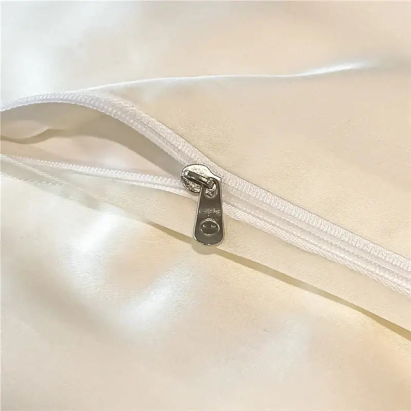 Silver zipper pull with smiling face on white satin eucalyptus fiber bedding set from decorbites eucalyptus fiber collection