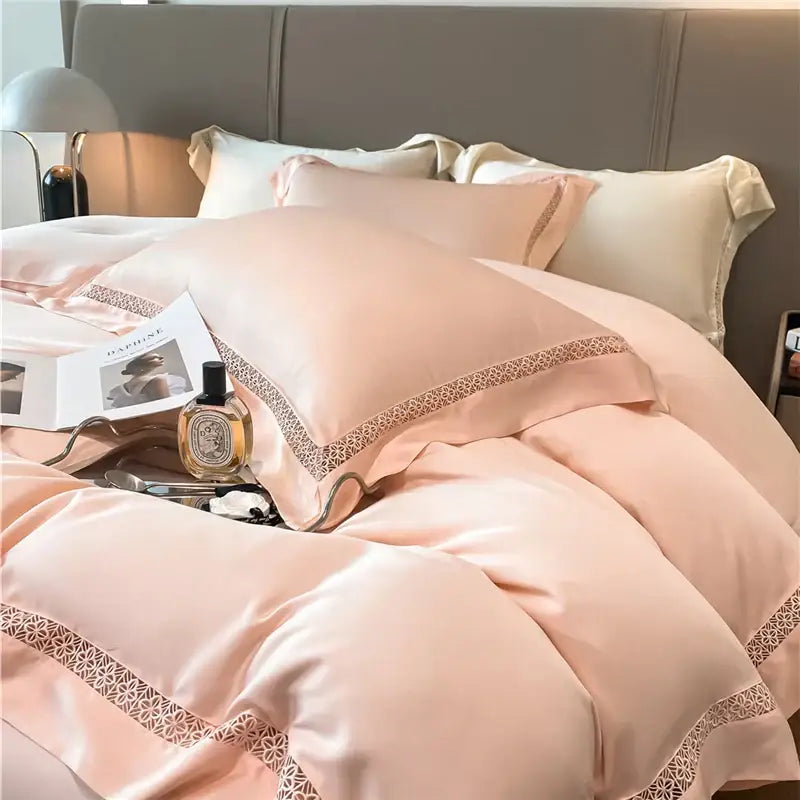 A soft blush pink satin eucalyptus fiber bedding set with delicate lace trim for bedroom comfort by decorbites eucalyptus fiber