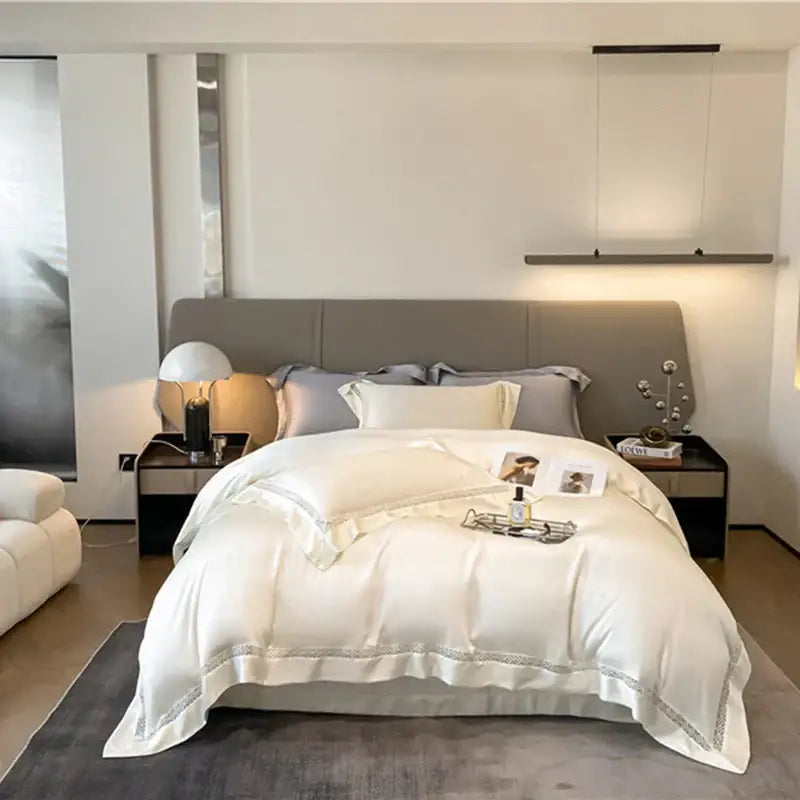 Cream eucalyptus fiber lace bedding set featuring a white satin duvet cover with delicate silver embroidery hem decorbites eucalyptus fiber