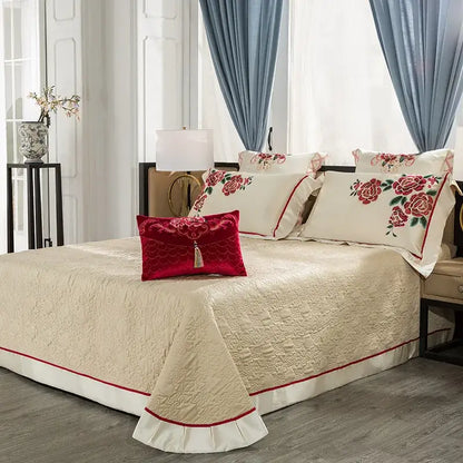 Cream floral 200s embroidery egyptian cotton bedding set with quilted bedspread, red piping, ruffled hem, and matching pillows