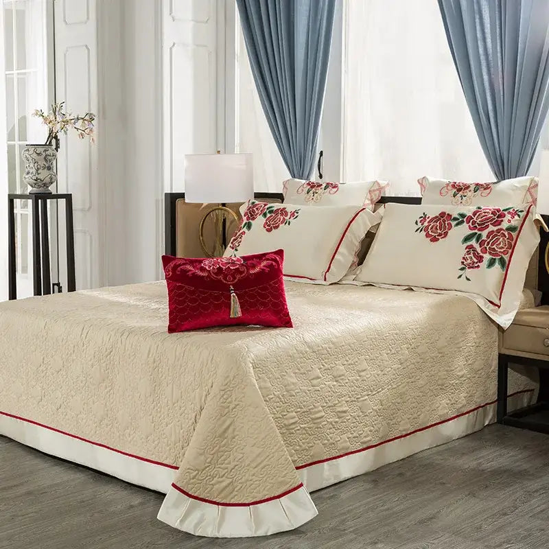 Cream floral 200s embroidery egyptian cotton bedding set with quilted bedspread, red piping, ruffled hem, and matching pillows