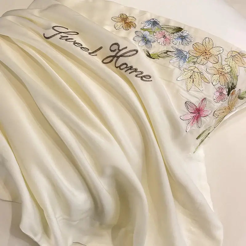 Cream satin pillowcase with delicate flowers embroidery silky design and sweet home decor for elegant bedroom use