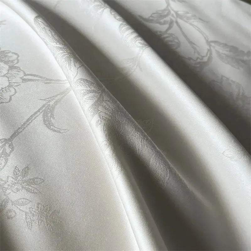 Cream floral jacquard bedding set featuring silk-like satin fabric with subtle silver floral pattern by decorbites jacquard bedding