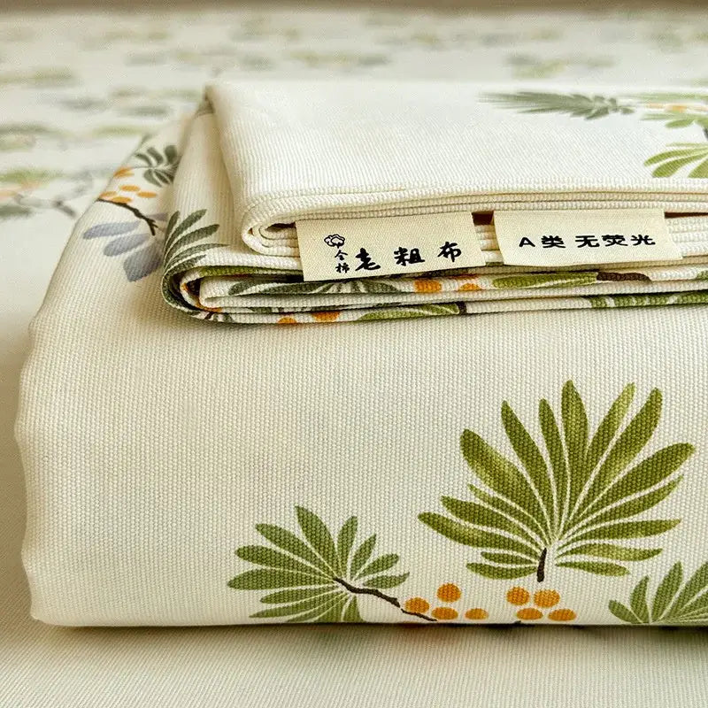 Cream off-white cotton bed cover with green leaf and orange berry flower print from decorbites cooling cotton collection