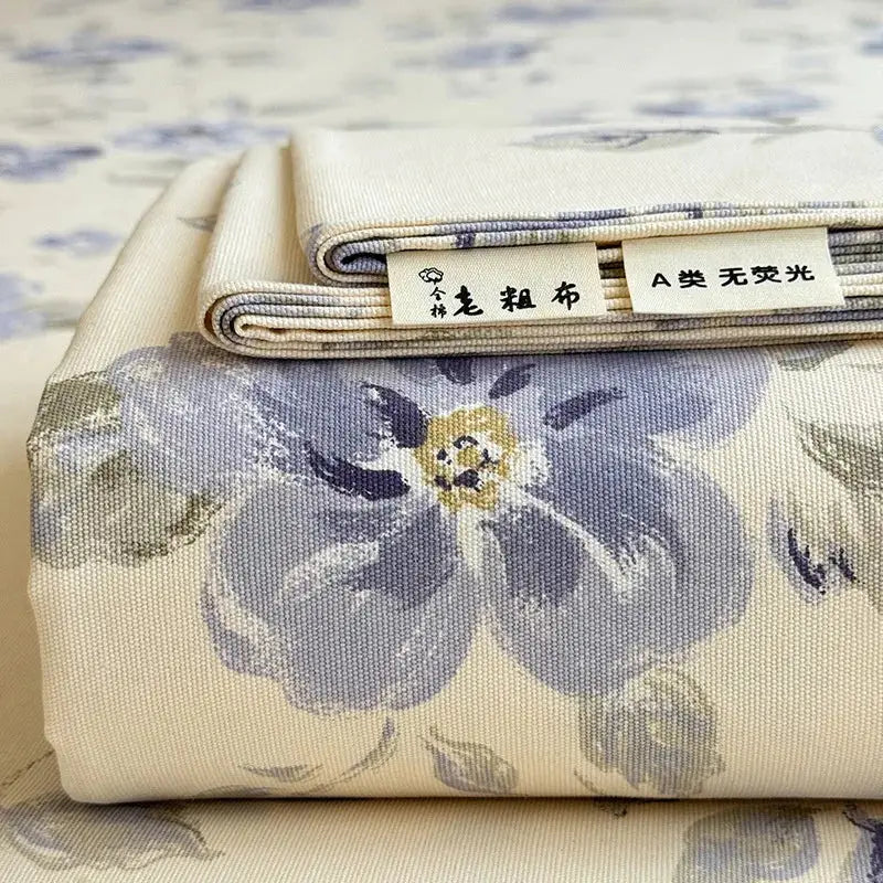 Cream flower print satin bed cover with beige decorbites cooling cotton fabric and large blue floral pattern