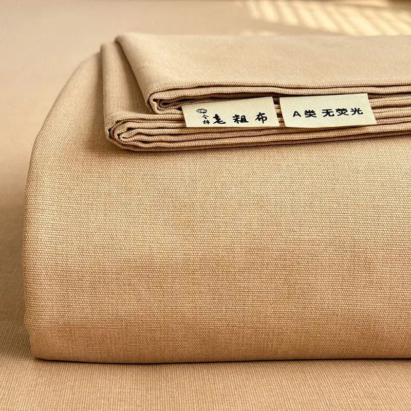 Beige textured cotton fabric with woven labels on the back of a cream flower print satin bed cover by decorbites cooling cotton