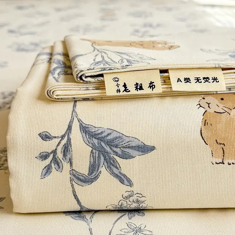Cream flower print satin bed cover made of beige cotton with delicate blue botanical and beige animal print decorbites cooling cotton