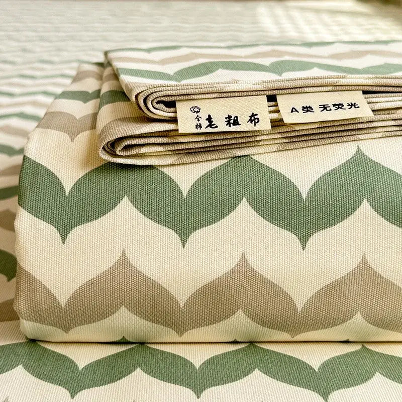 Folded cream flower print satin bed cover with chevron pattern in green and beige woven texture for decorbites cooling cotton