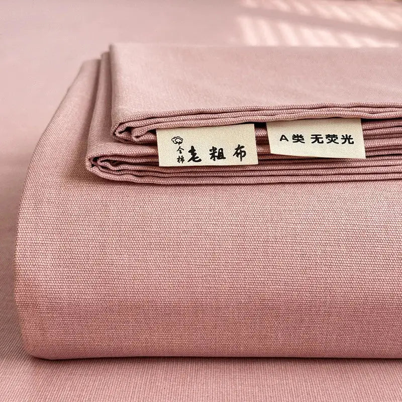 A soft pink textured cotton bed cover with subtle woven pattern designed for decorbites cooling cotton mattress use