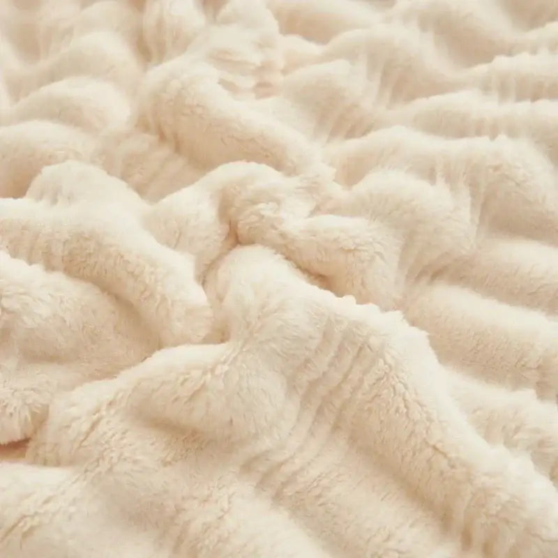 Cream fluffy rabbit plush quilted blanket with soft cream-colored plush fabric and gentle textured ripples for warm bedding