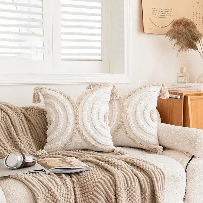 Cream pillow cover with geometric embroidered crocheted concentric circles and tassel accents for living room decorbites decor