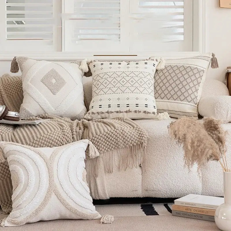 Cream pillow cover with geometric embroidered crocheted design and tassel accents for living room decorbites decor