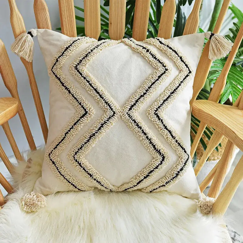 Cream-colored cushion cover with black and beige geometric embroidery and textured tassels for living room decorbites geometric embroidery