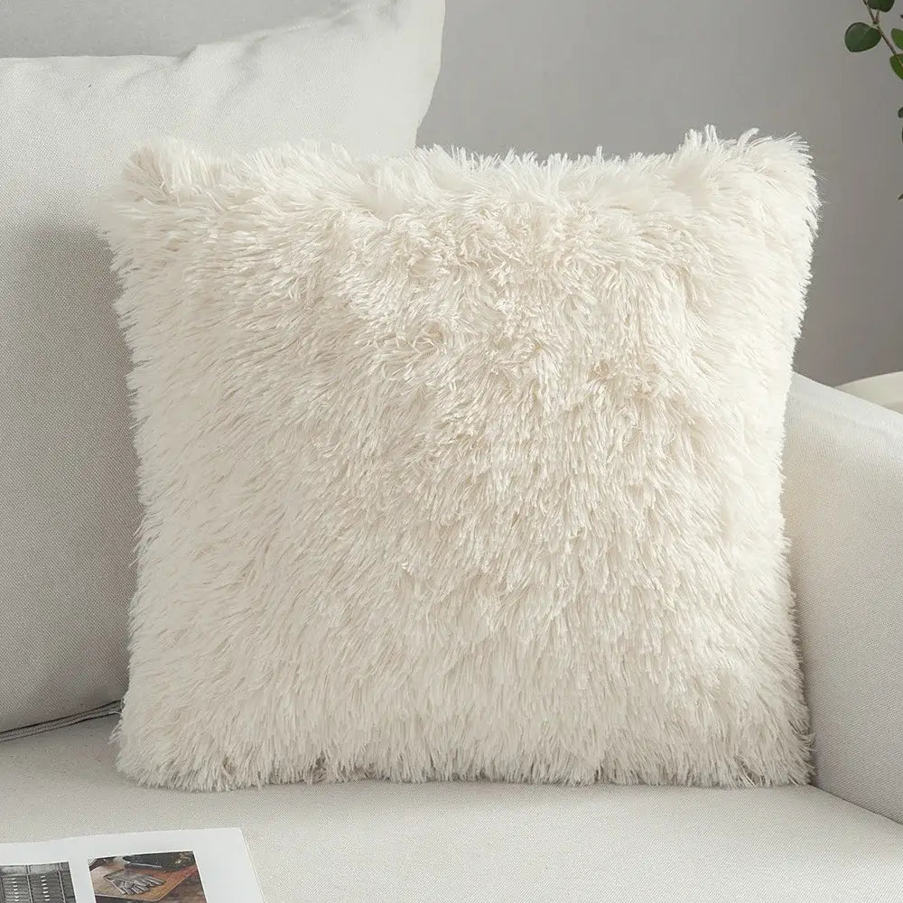 Cream-colored plush faux fur cushion cover with soft shaggy texture and geometric embroidery for living room decorbites