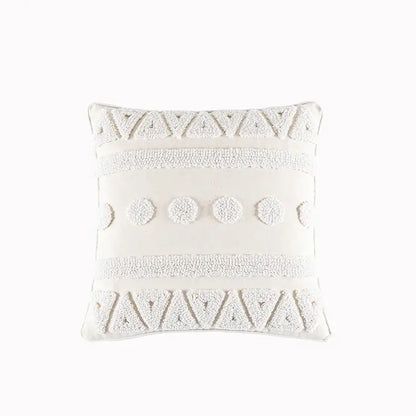 Off-white square cushion cover with cream geometric embroidery and textured tassels featuring tufted patterns