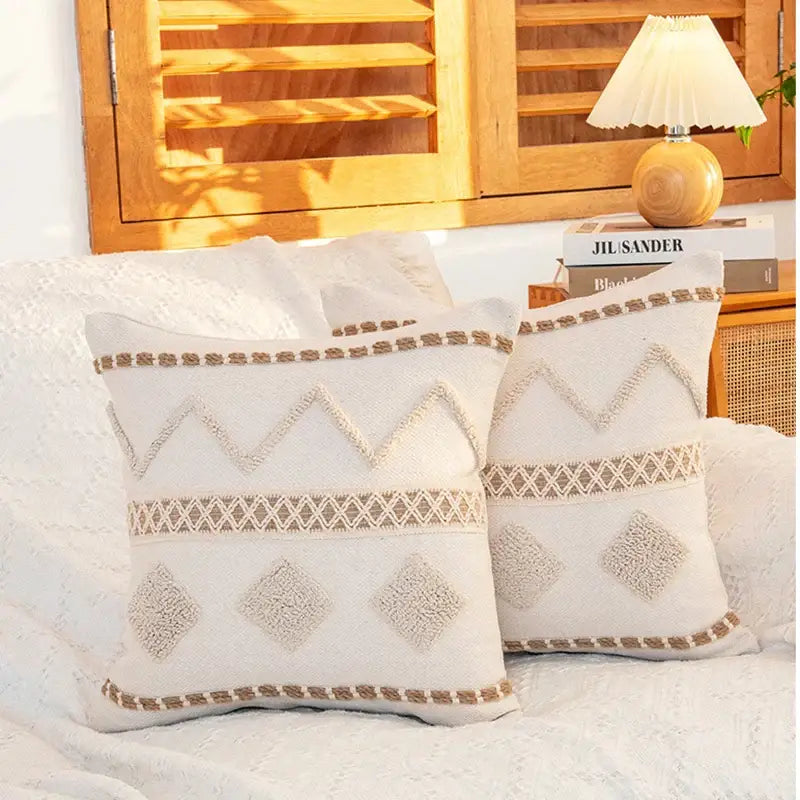 Cream geometric tufted cushion cover with textured beige and off-white woven diamond and zigzag patterns for decorbites
