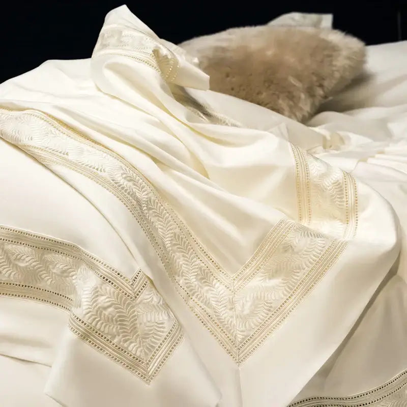 Cream gold wide edge embroidery bedding set in two sizes featuring cream satin with intricate gold-thread decorbites design