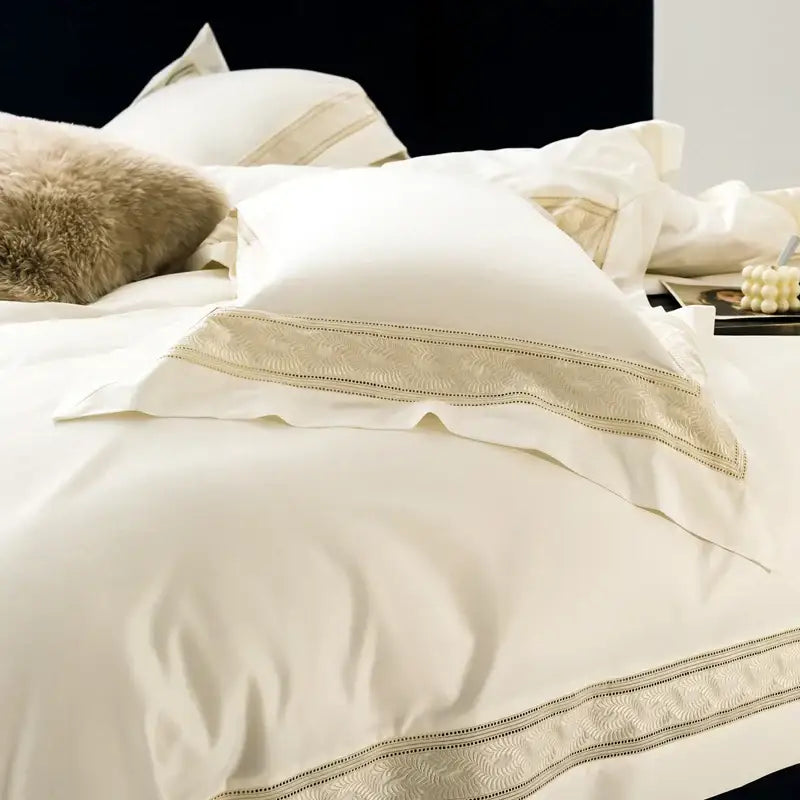 Cream-colored satin pillowcases with gold-threaded wide edge embroidery from decorbites bedding set available in two sizes