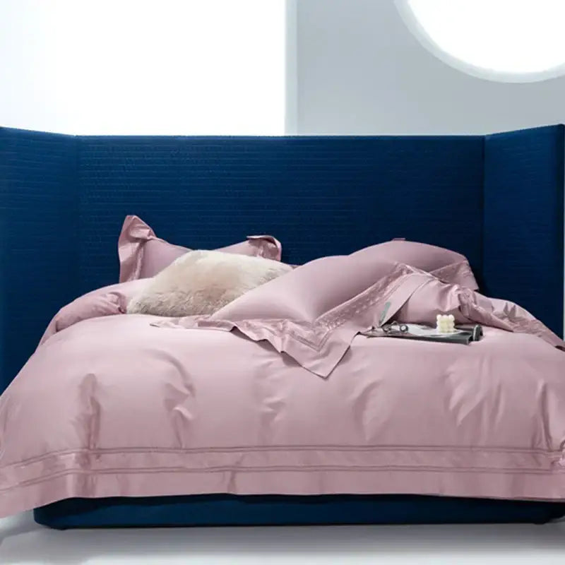 Pink satin bedding set with subtle cream gold wide edge embroidery and plush cream pillow from decorbites bedding set two sizes
