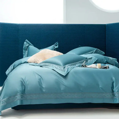 Teal satin bedding set with embroidered trim and matching pillows from decorbites bedding set available in two sizes