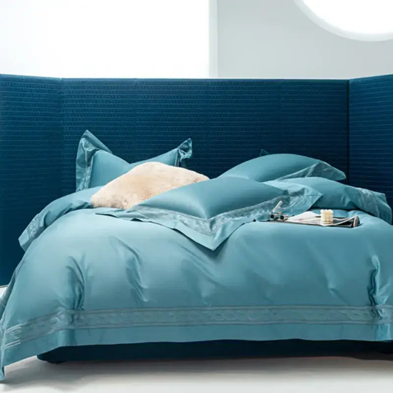 Teal satin bedding set with embroidered trim and matching pillows from decorbites bedding set available in two sizes