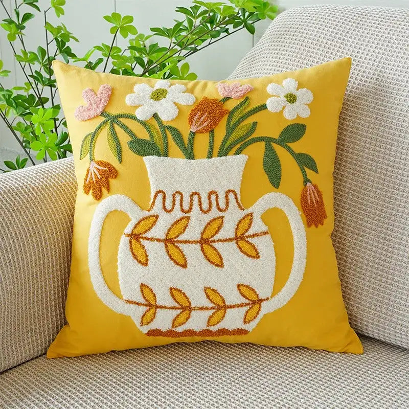 Yellow cushion with decorbites green tulip embroidery featuring white vase and floral design for living room decor