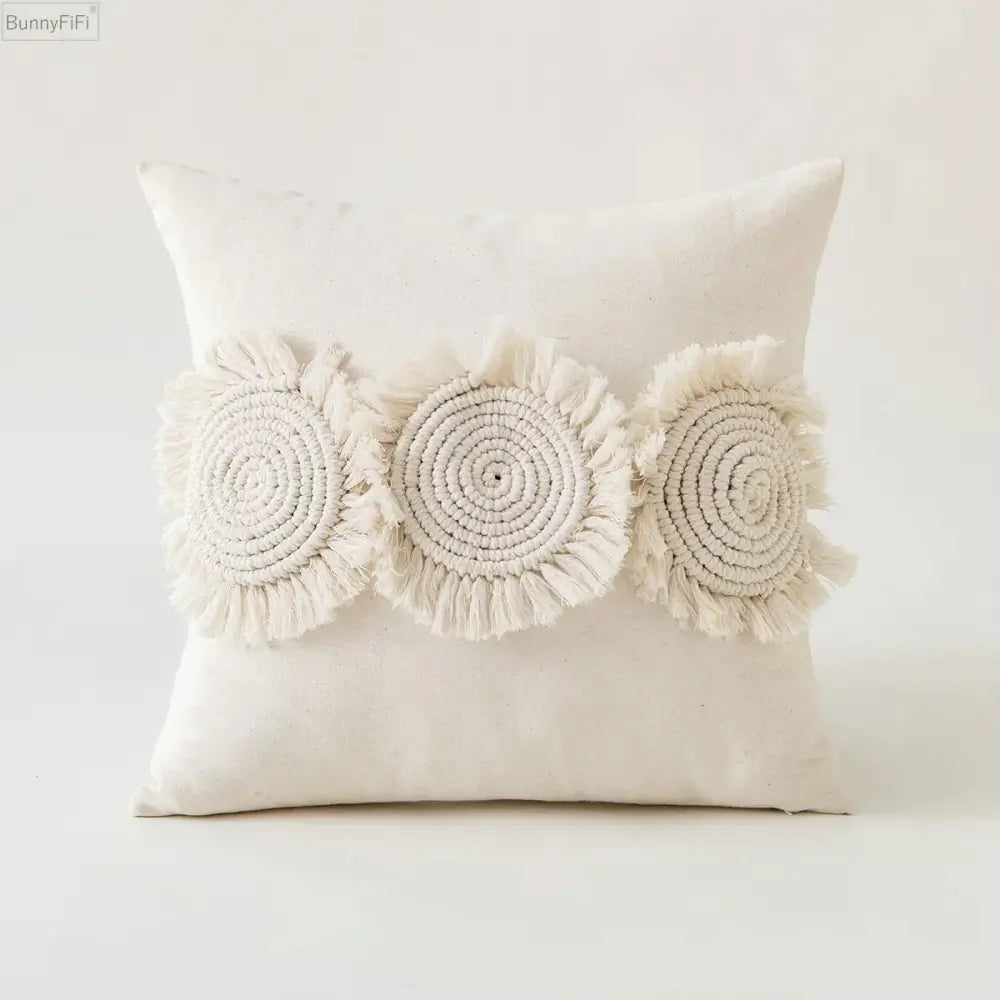 Cream-colored pillow cover with three handcrafted macrame ivory pompom tassel appliqués for living room decorbites decor